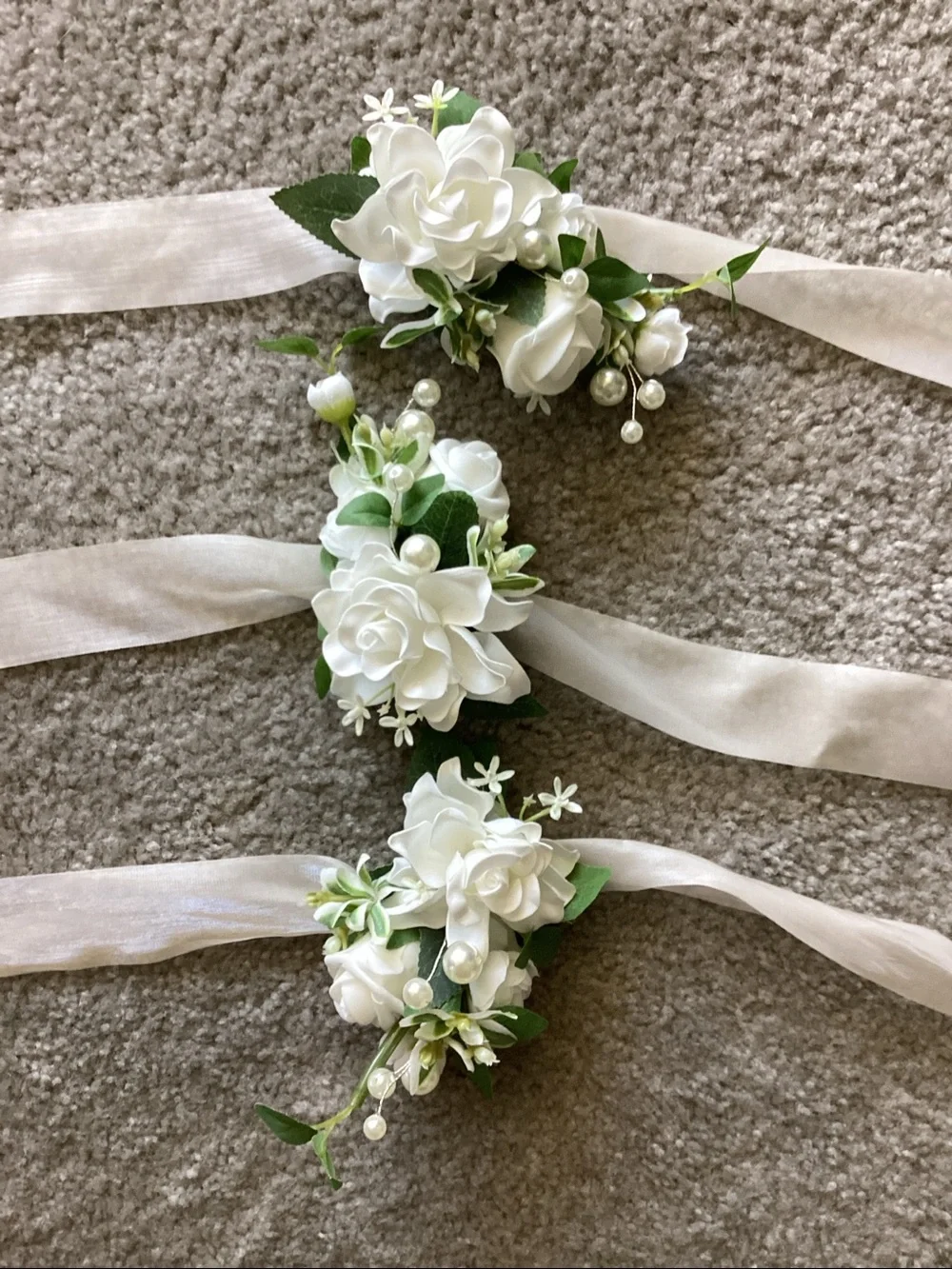 White Floral Wrist Corsage with Ribbon Tie - 2 corsages are new and 1 was used.